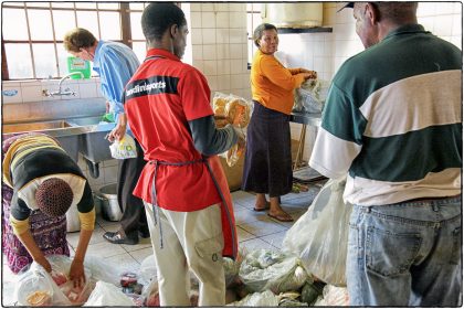 Volunteers sorting out the day's food.