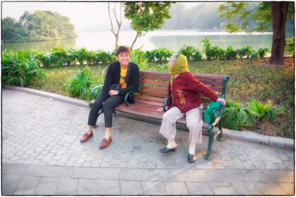 Having a chat. Hoan Kiem Lake -Hanoi.
