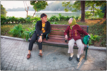 Having a chat. Hoan Kiem Lake.